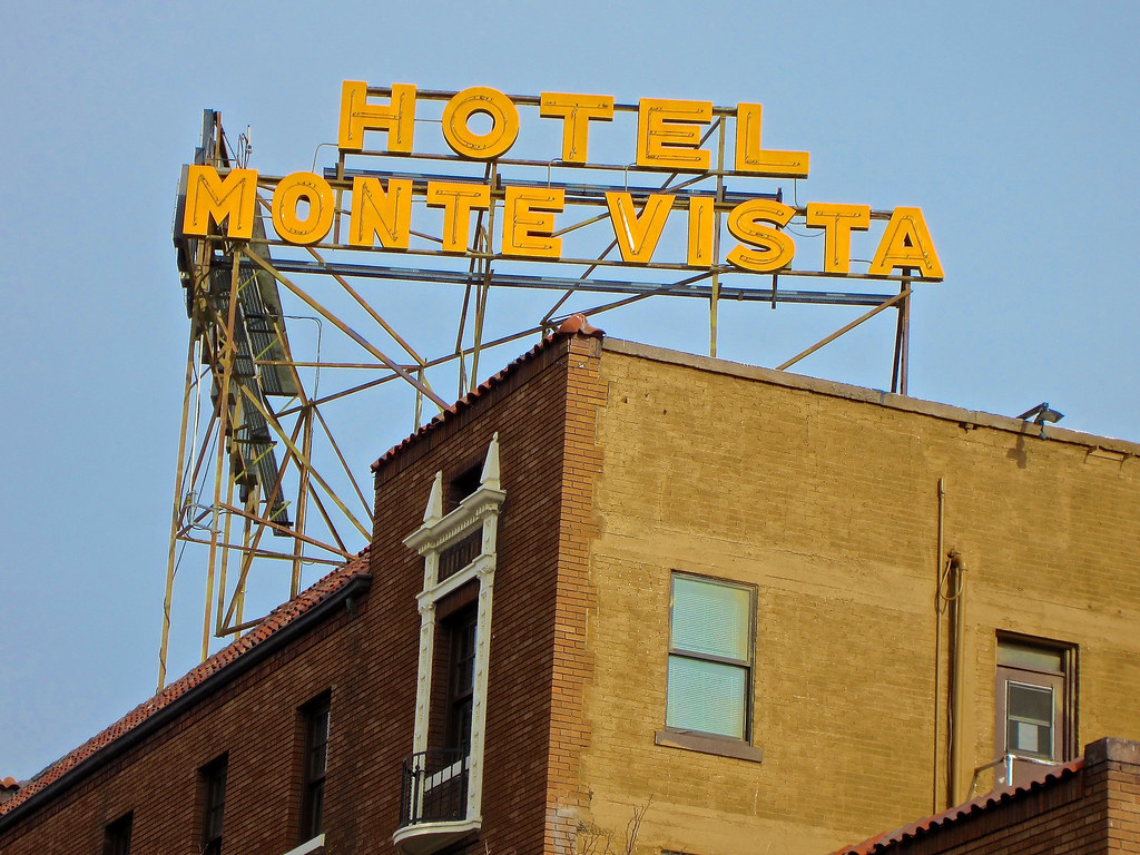 photo shows the hotel monte vista sign in yellow which reads 'hotel monte vista'