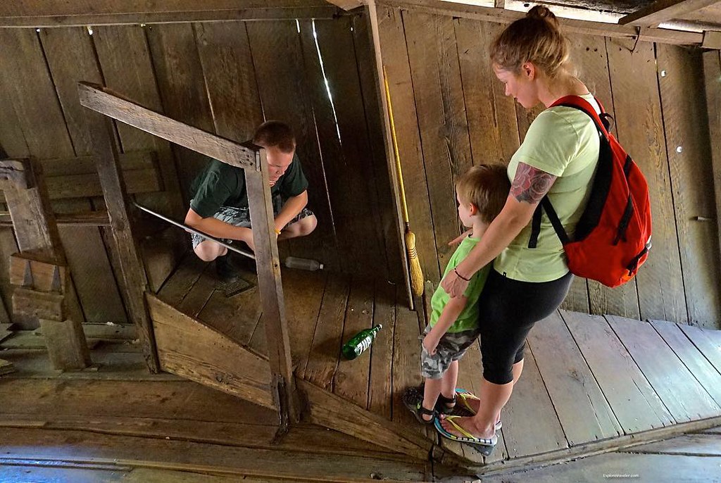 photo shows a vortex employee showing a young child and his mom a bottle rolling uphill