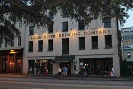 photo of white building labeled Moon River Brewing Company. 