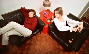 photo shows roman polanski and sharon tate sitting on two leather chairs 