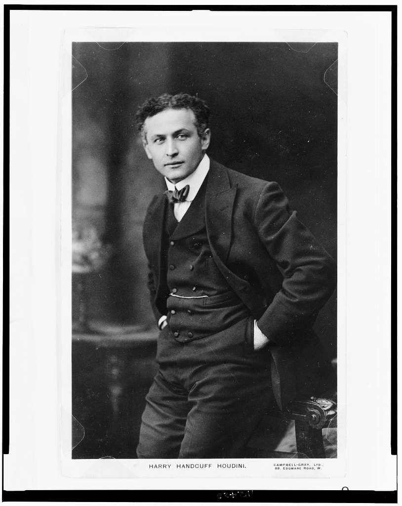 Black and white photograph of Harry Houdini Handcuffed