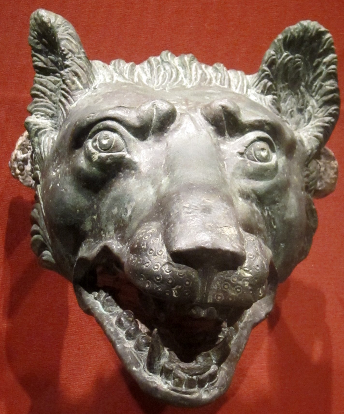 A bronze wolf head