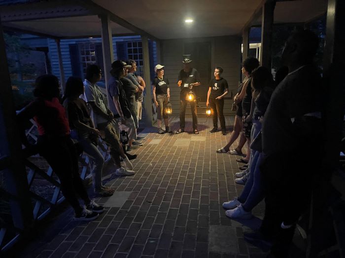 A group of people being entertained in a US Ghost Adventures Ghost Tour